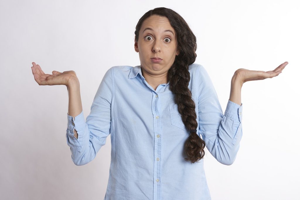 woman shrugging and looking confused